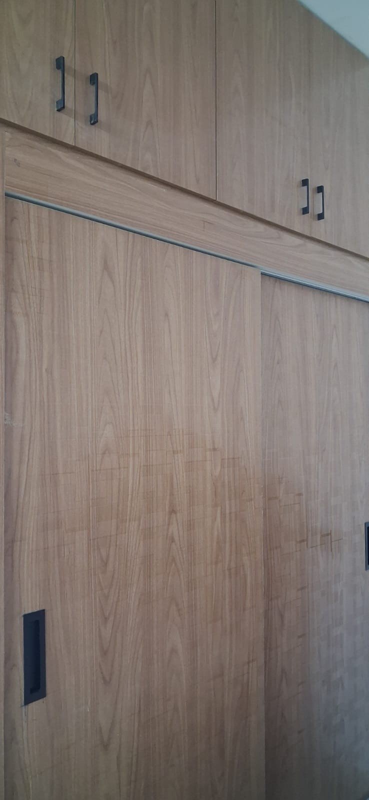 Wooden sliding door wardrobe design by Anjaneya Interiors, Coimbatore
