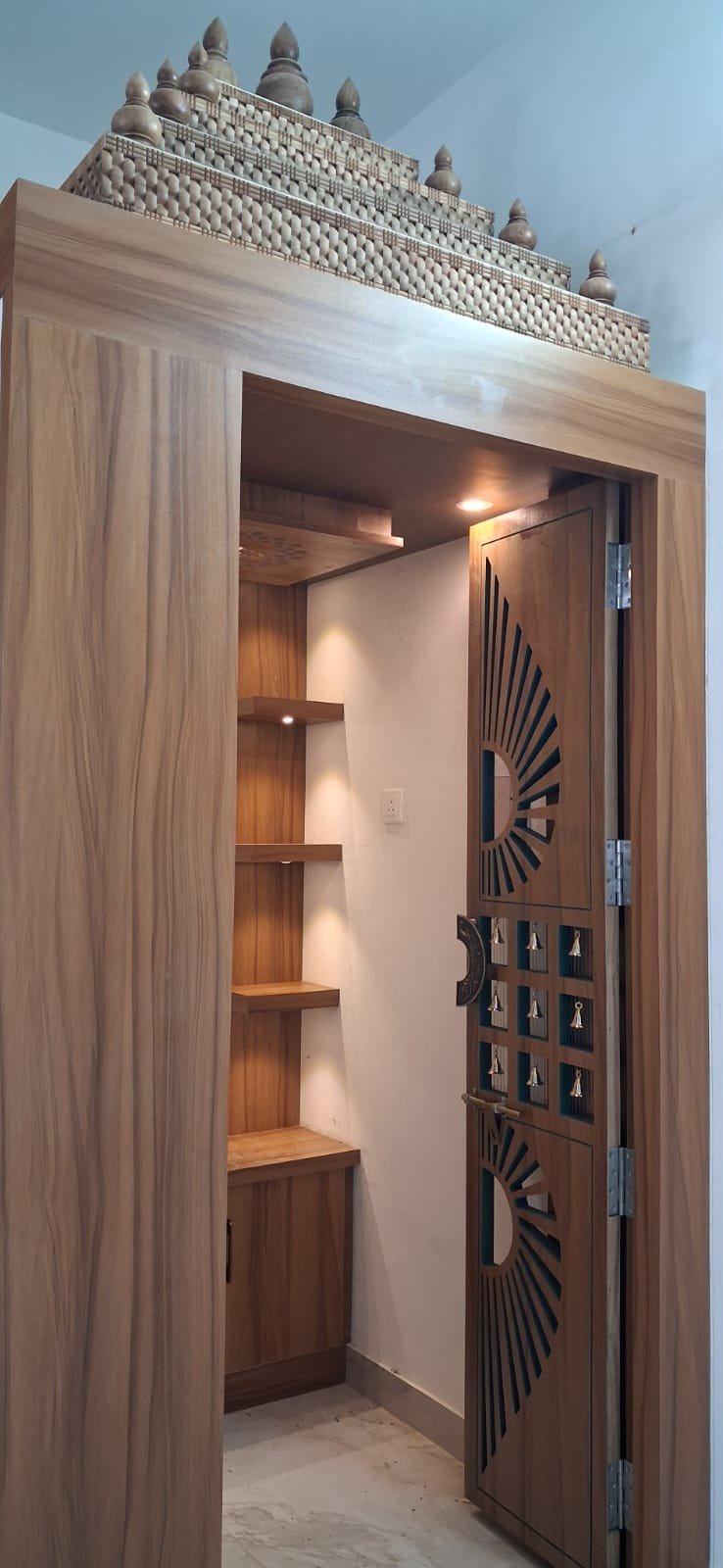 Modular kitchen with pendant lighting by Anjaneya Interiors, Coimbatore