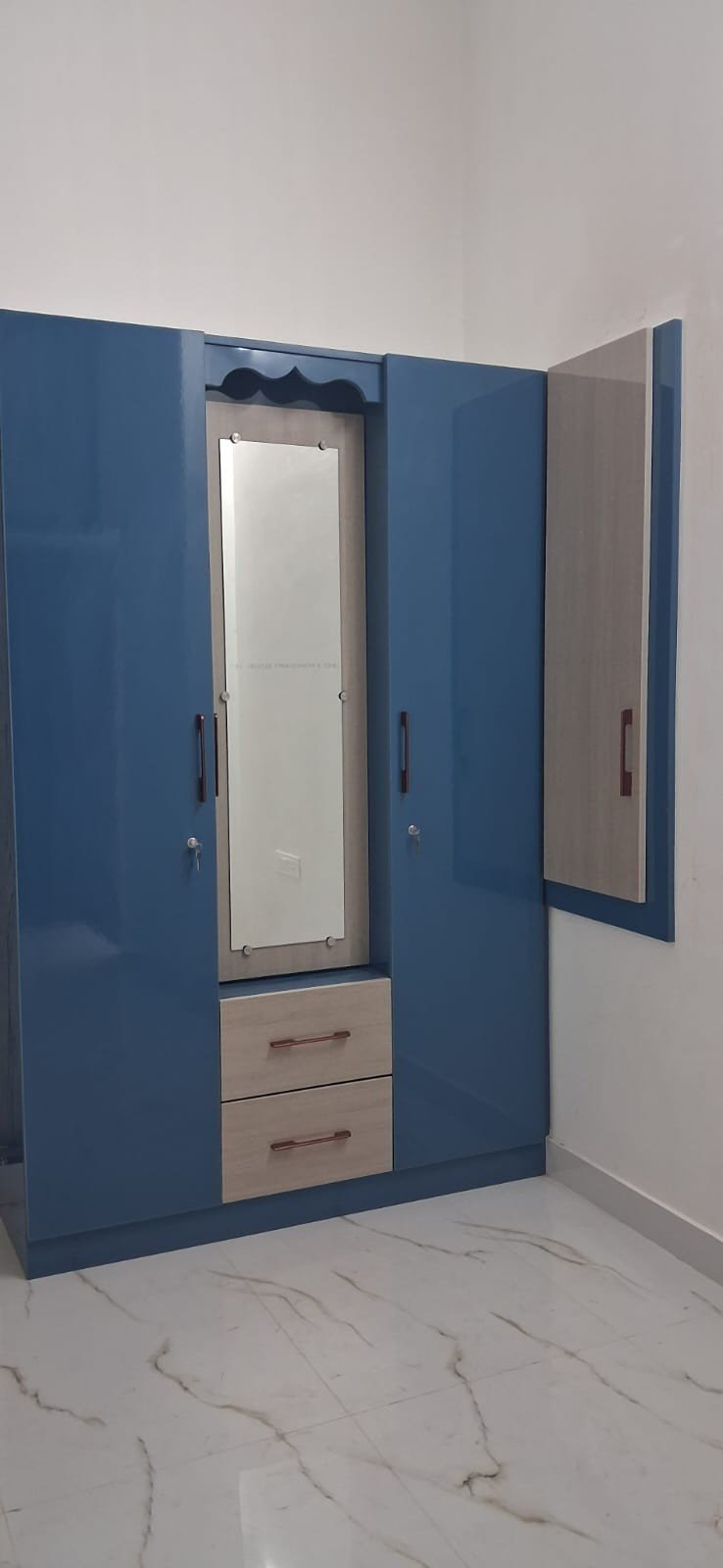 Green and wood finish wardrobe design by Anjaneya Interiors